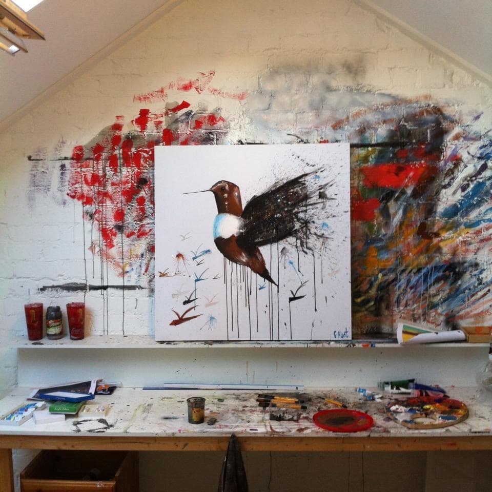 The studio, with a canvas on the easel